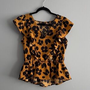 Ruffled Peplum Blouse with Bold Print
